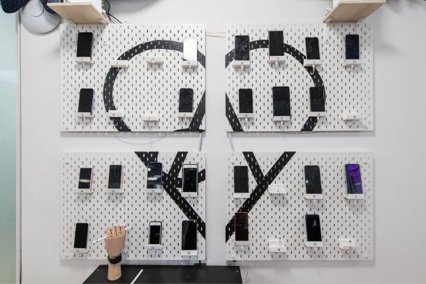Device wall with various test phones at Apps with love