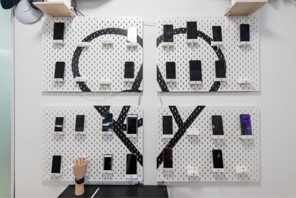 Device wall with various test phones at Apps with love
