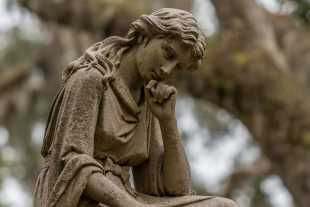 Statue of a thinking woman