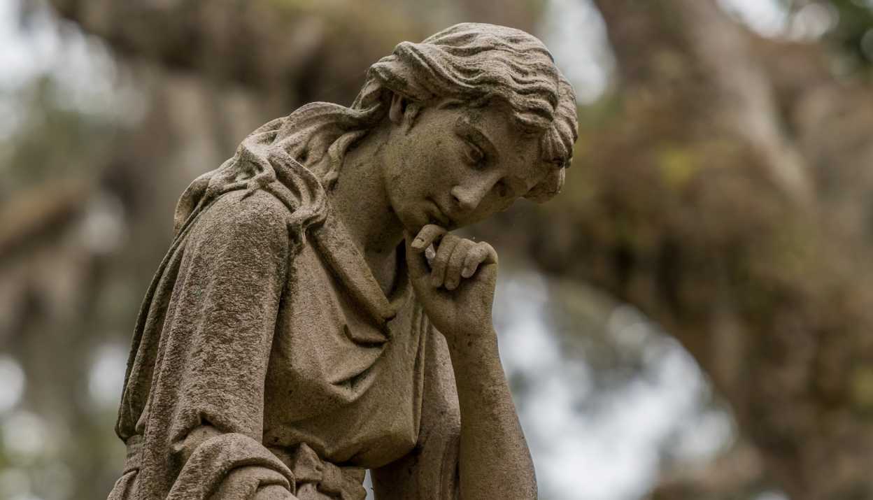 Statue of a thinking woman