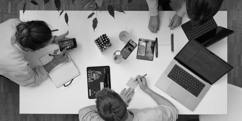 blokk team working at the desk from bird's eye view
