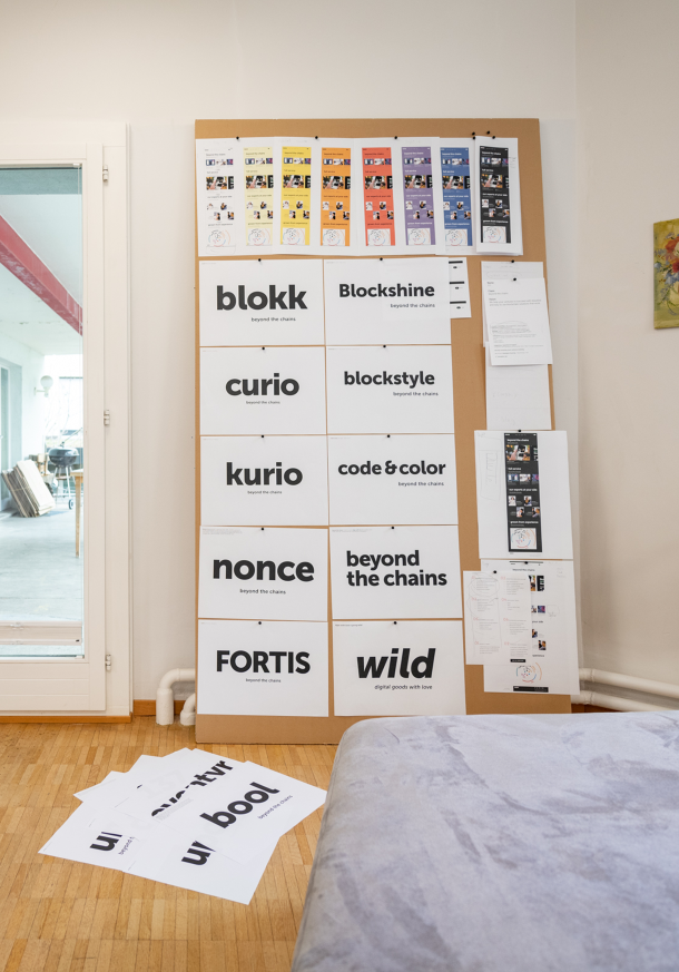 Various brand names and claims hung on a partition wall